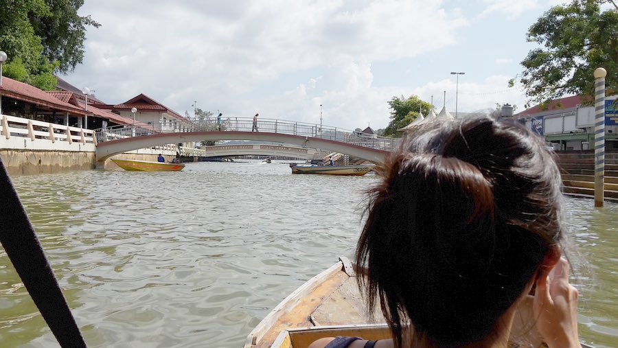 sister looks down the canal in Bandar