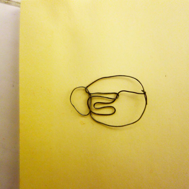 27: Two-dimensional wire sculpture of a teacup