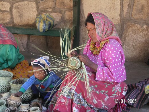 badass craftwoman wearing a kerchief, expertly weaving a basket