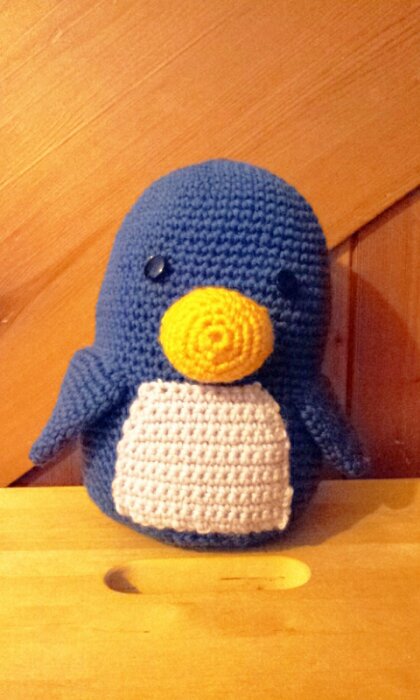 A blue and white crochet penguin, c. 2012