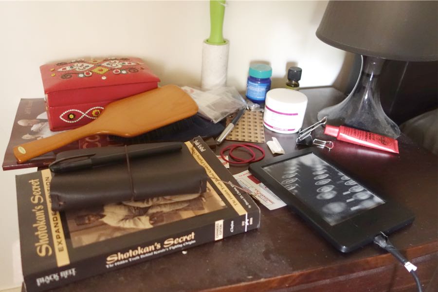 messy, dusty bedside table