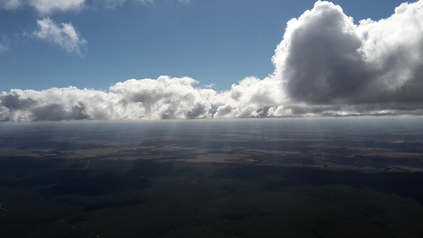 white fluffy clouds at eye level