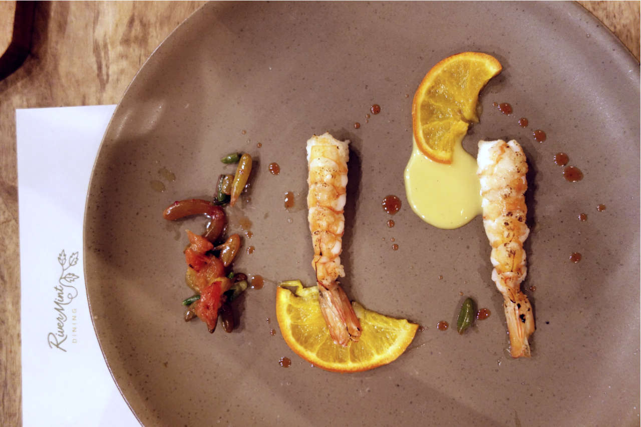 Prawns and salty sides on a plate