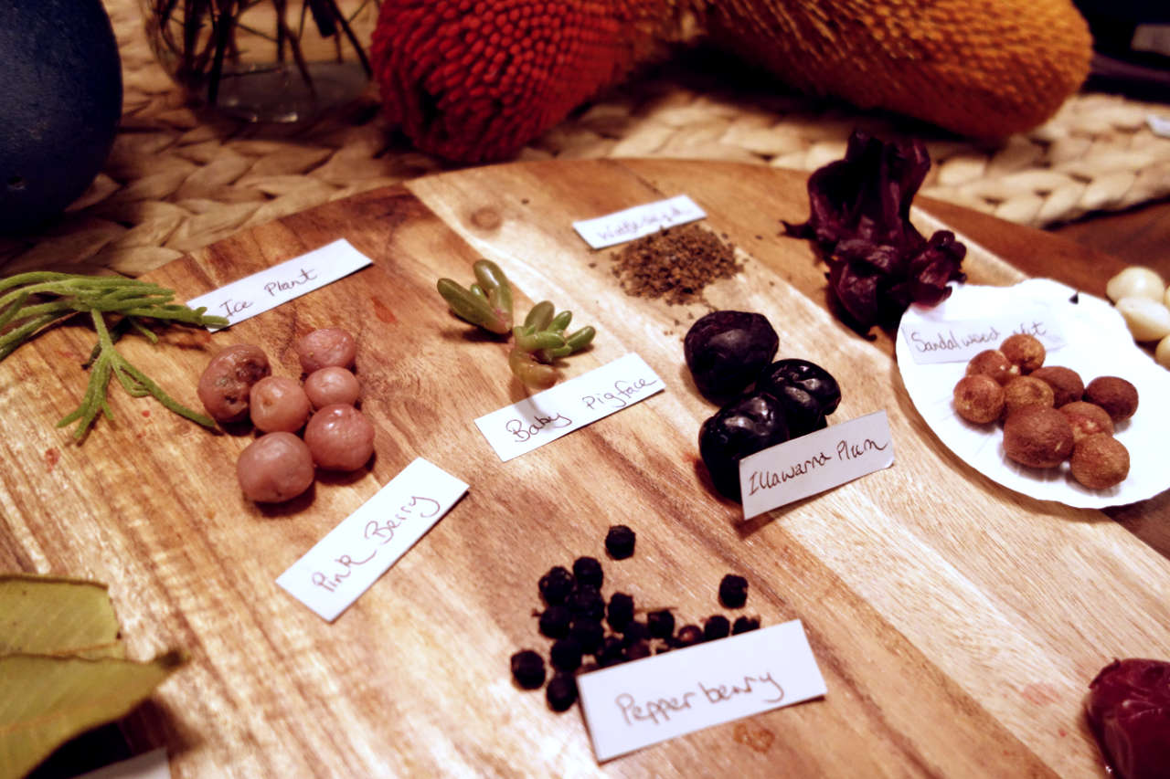 Pink berry, baby pigface and Illawarra Plum on a wooden tray